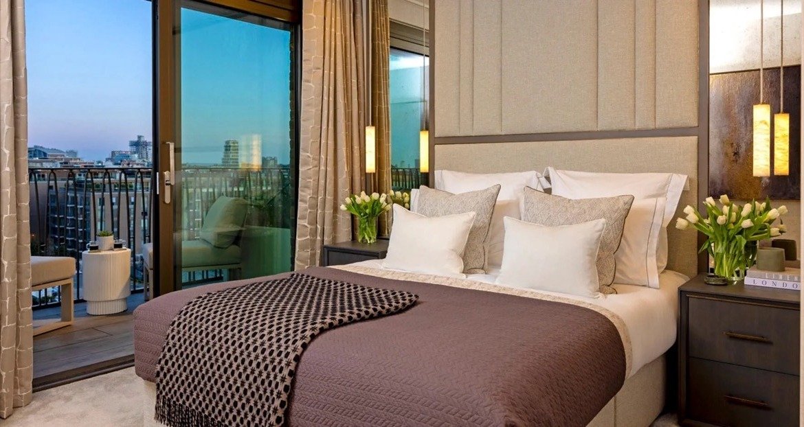 Bedroom with balcony and city views at Kings Road Park London