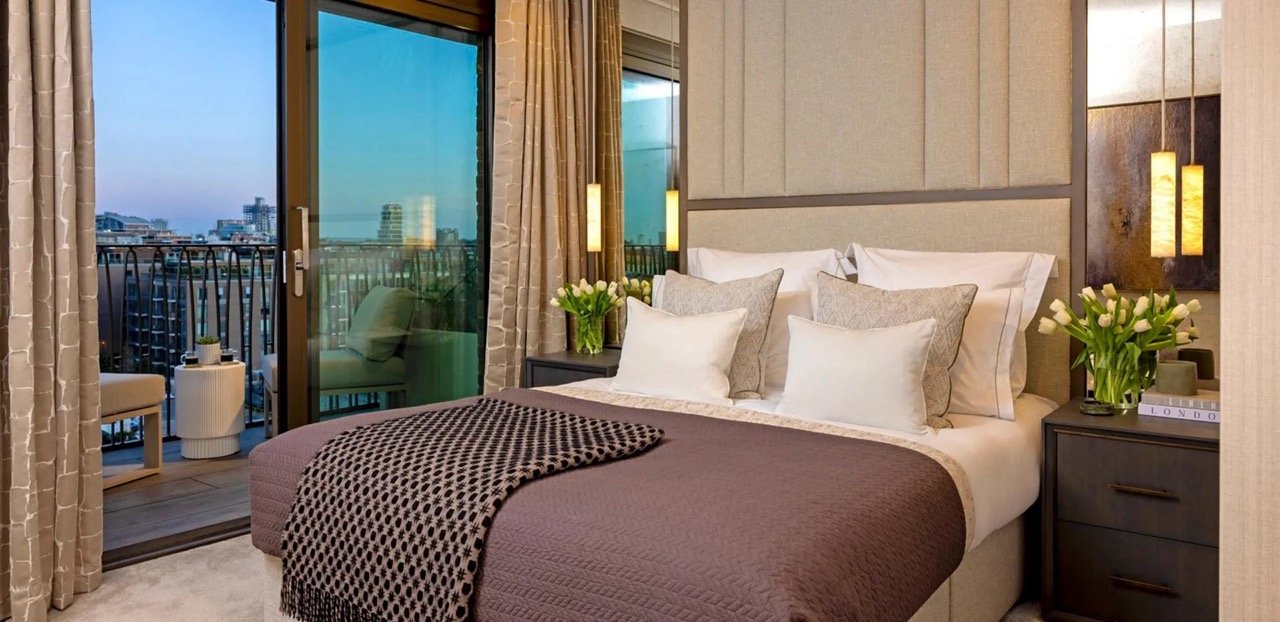 Bedroom with balcony and city views at Kings Road Park London