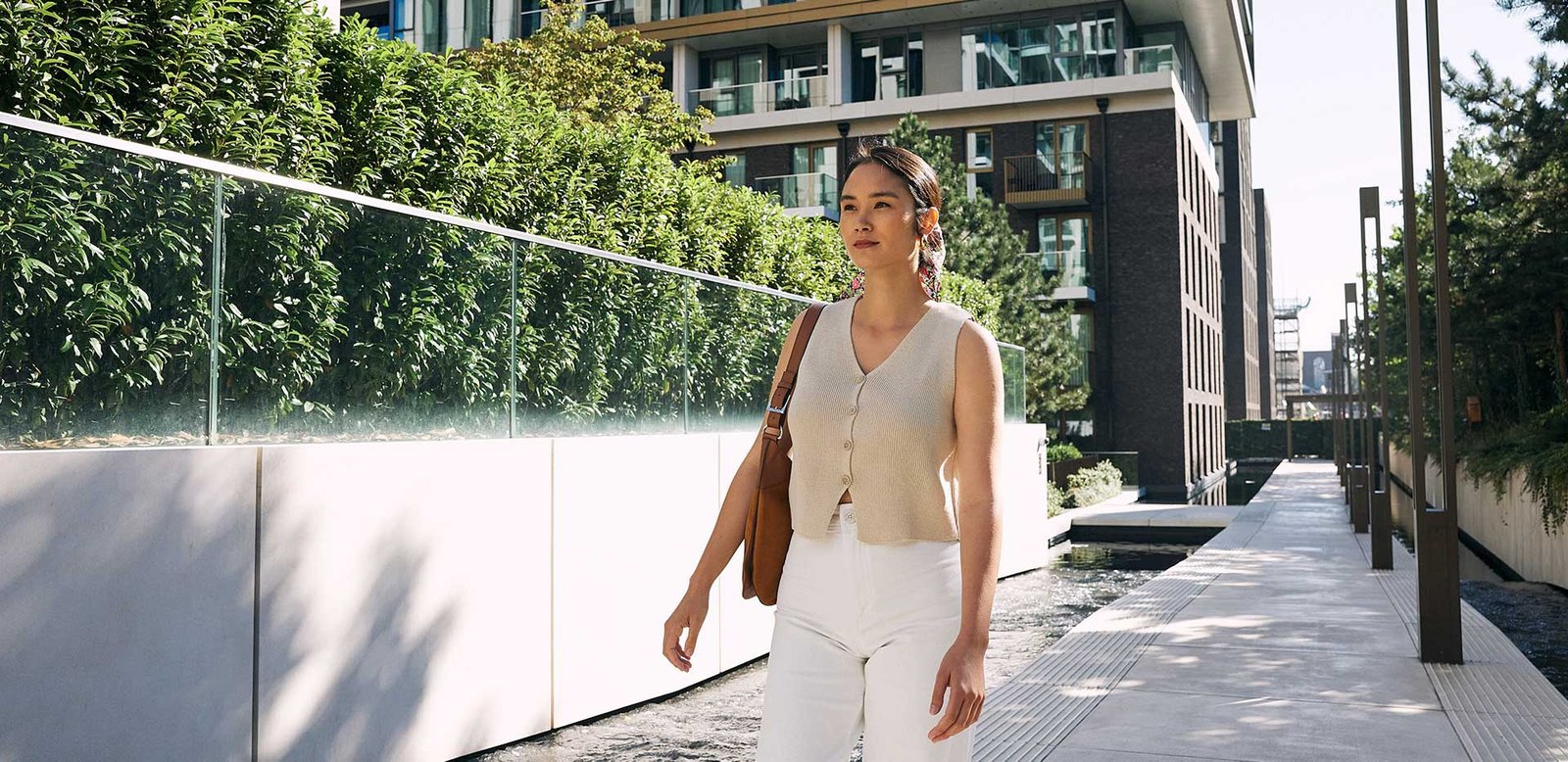 Private green open space in London apartment development with trees and relaxing environment