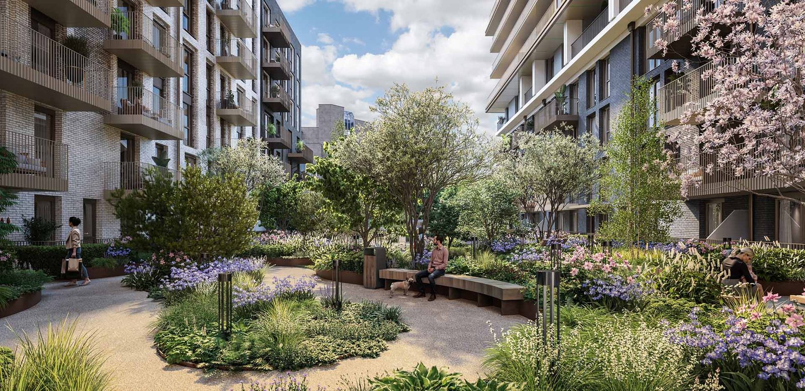 Landscaped courtyard garden in a London residential development with greenery and seating areas