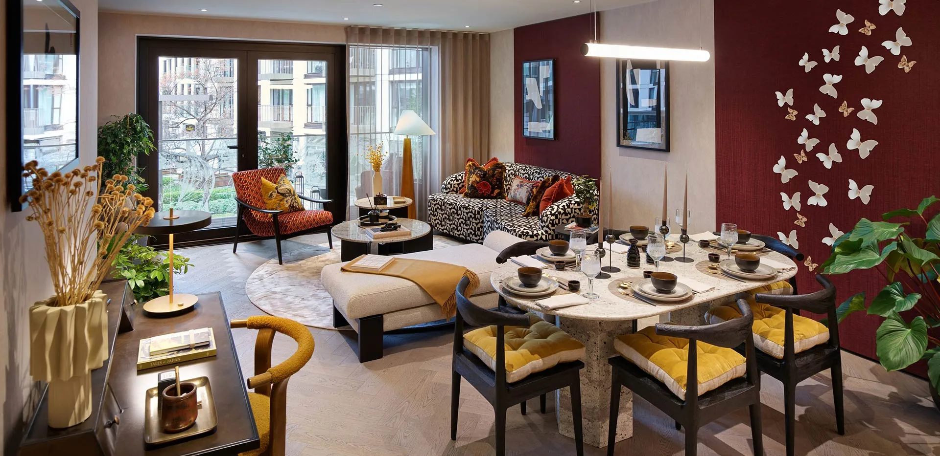 Open plan living area in a London apartment with large windows and contemporary interior design