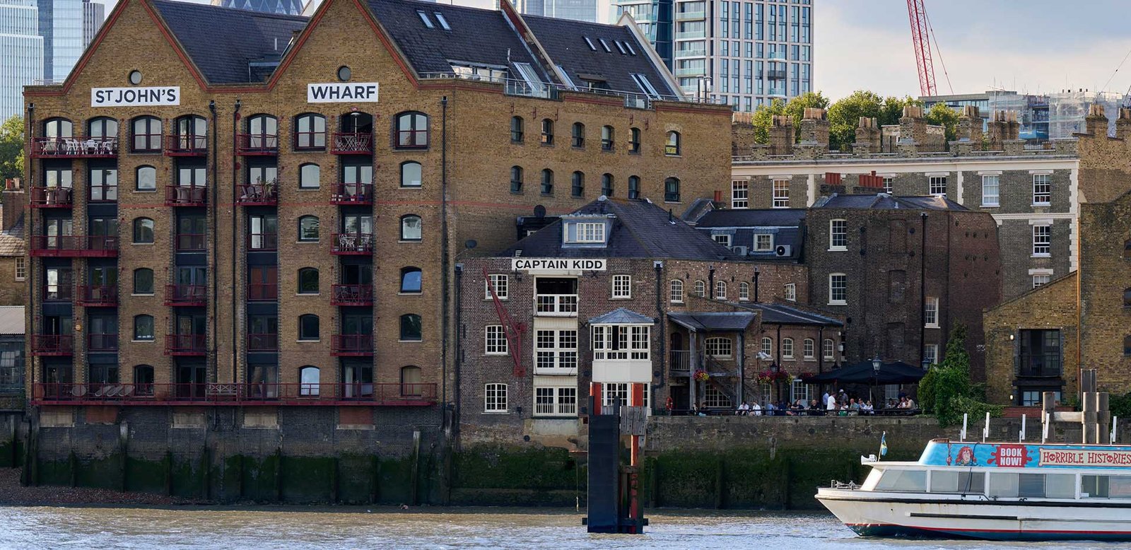 St Johns Wharf area in London with modern developments and riverside surroundings