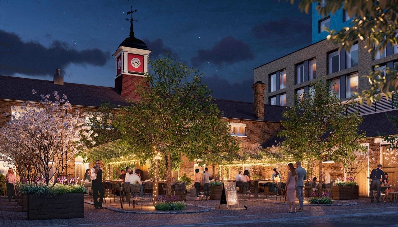 Evening courtyard terrace with outdoor dining, lighting and landscaped surroundings - 3 bedroom