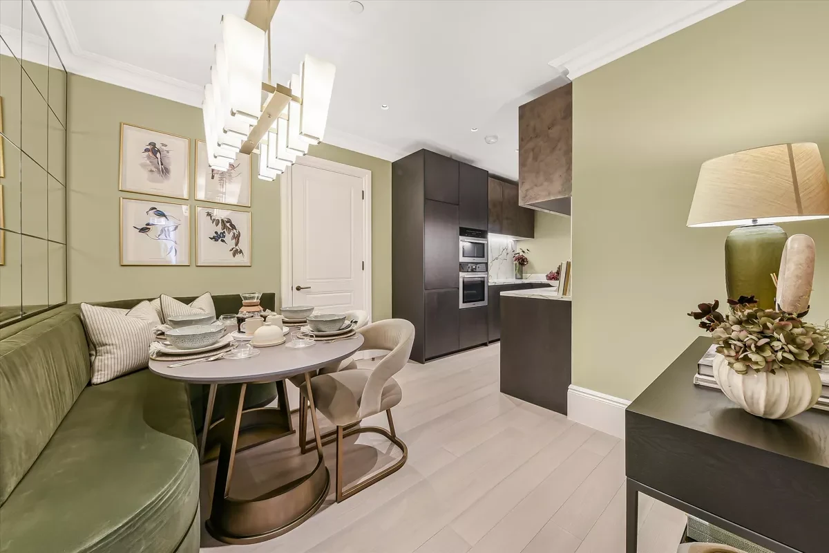 Allen House Kensington W8 Luxury Apartment Kitchen Dining Area Marble Backsplash Dark Cabinetry