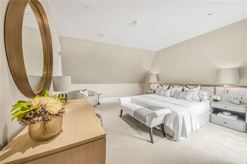 Allen House Penthouse Kensington W8 Principal Bedroom White Scheme Gold Oval Mirror Vaulted Ceiling Bench End