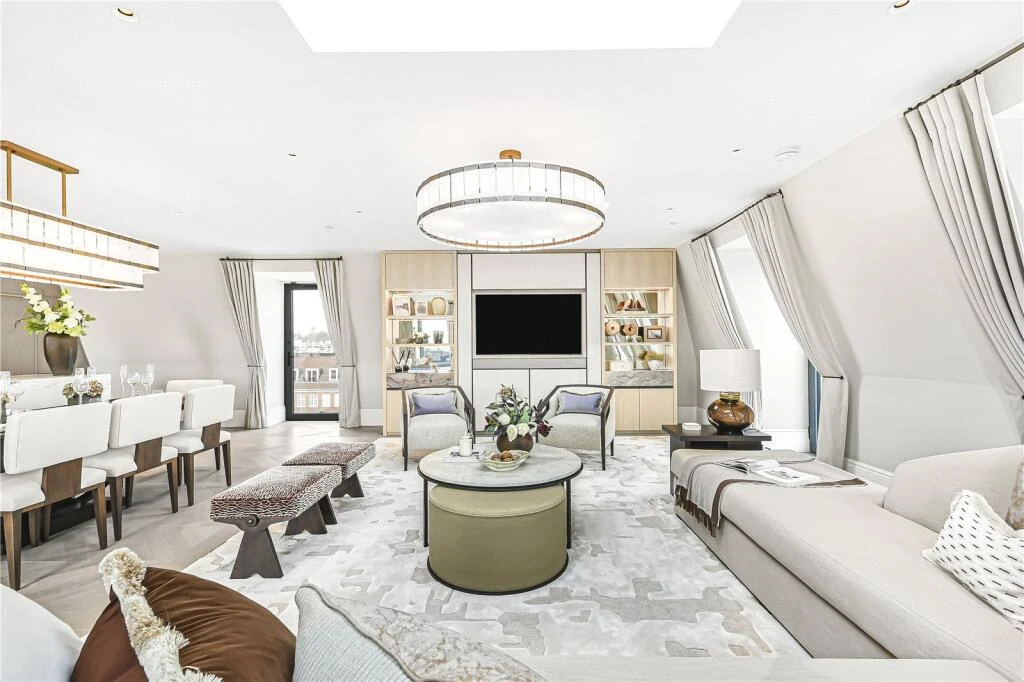 Allen House Penthouse Kensington W8 Reception Room Round Ottoman Skylights Bespoke Shelving Dining Glimpse