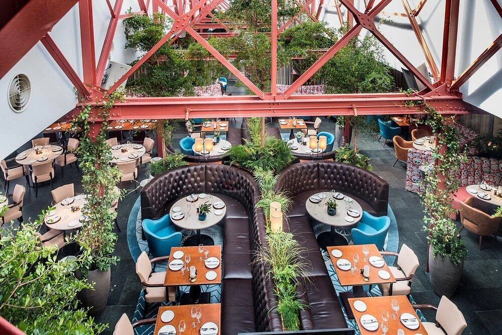 Chelsea Waterfront Sw10 Lots Road Power Station Restaurant Red Steel Trusses Banquette Seating Planting