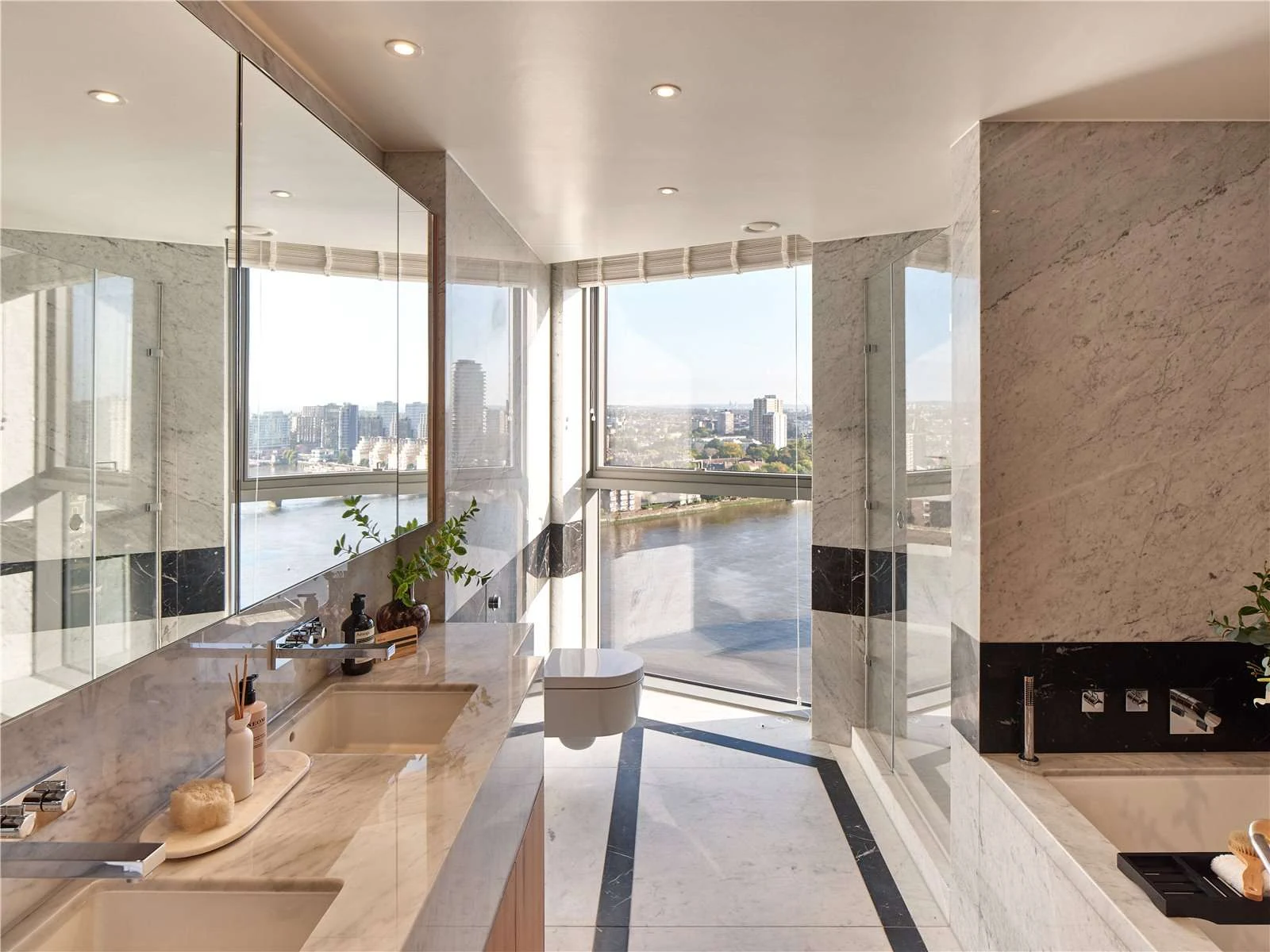 Chelsea Waterfront Sw10 Master Bathroom Carrara Marble Columns Black Bath Surround Floor Ceiling Thames View