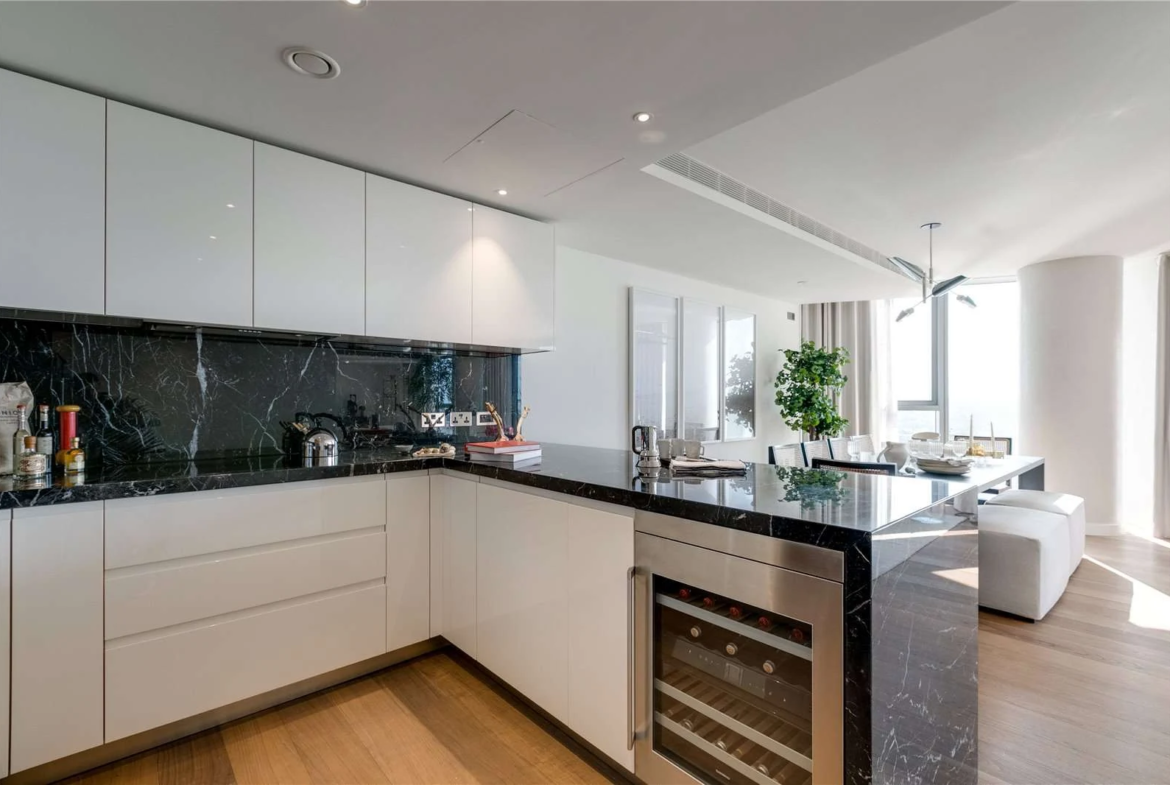 Chelsea Waterfront Tower West Sw10 Kitchen Gloss White Cabinets Black Marble Splashback Wine Fridge Open Plan