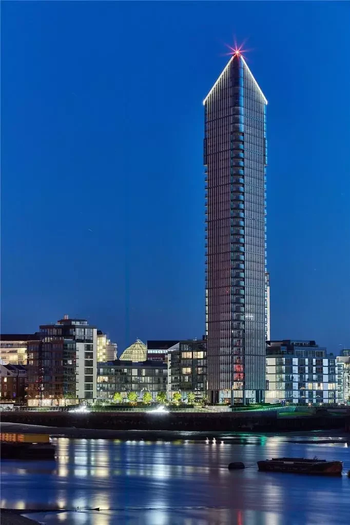 Chelsea Waterfront Tower West Sw10 Night Illuminated Glass Spire Red Beacon Blue Hour Thames Reflection