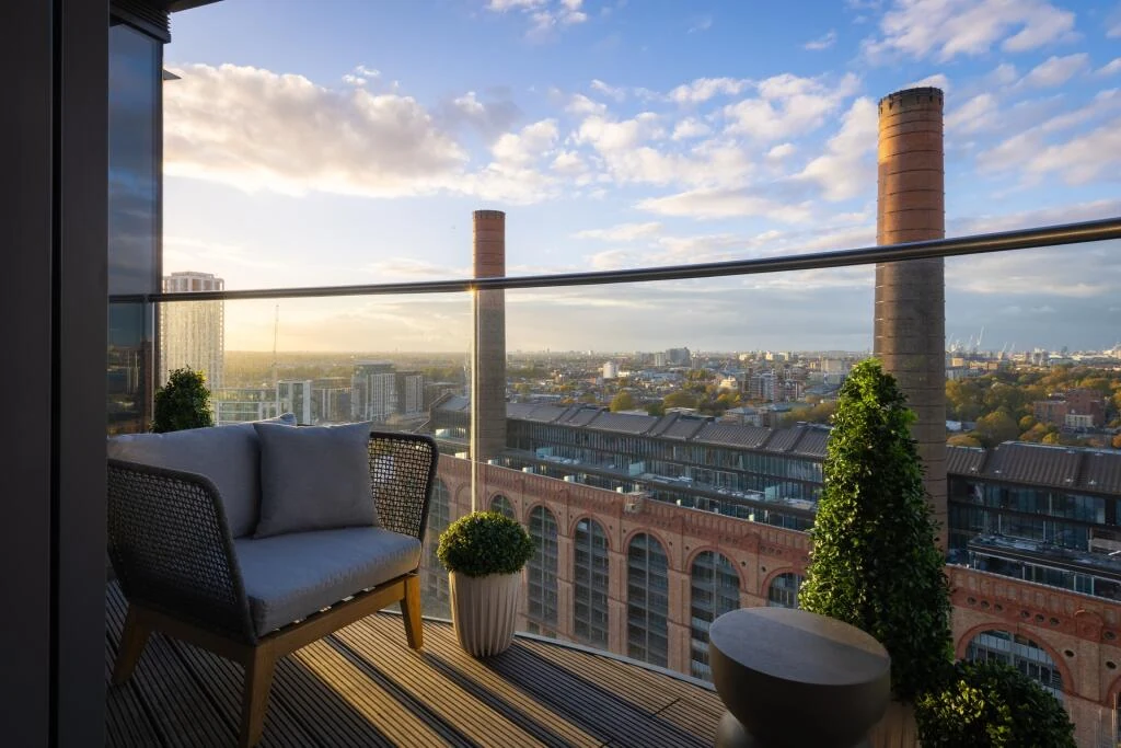 Chelsea Waterfront Tower West Sw10 Private Balcony Golden Hour Armchair Topiary Power Station Chimneys