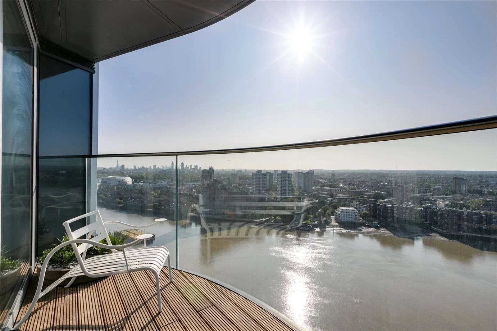 Chelsea Waterfront Tower West Sw10 Private Curved Balcony White Lounge Chair Thames London Skyline Sunlight