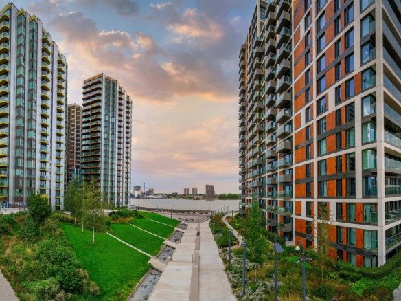 Royal Arsenal Riverside London modern apartments with Thames river views and landscaped green spaces at sunset