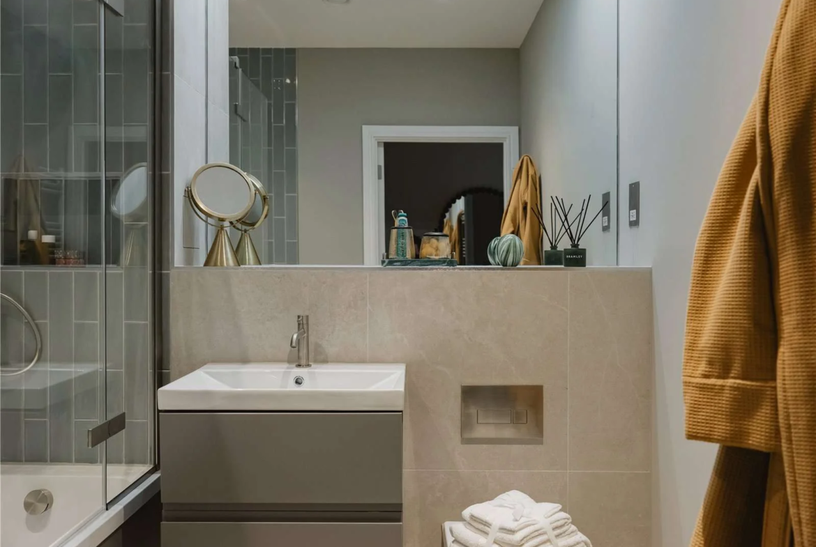 The Langdon Byron Street E14 London Bathroom Shower Vado Fixtures Stone Tiles Apartment