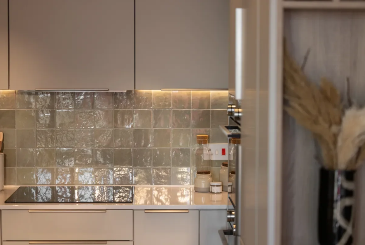 Artisi Hammersmith Town Hall London W6 2 Bed Apartment Kitchen Iridescent Zellige Splashback Induction Hob Cream Cabinets