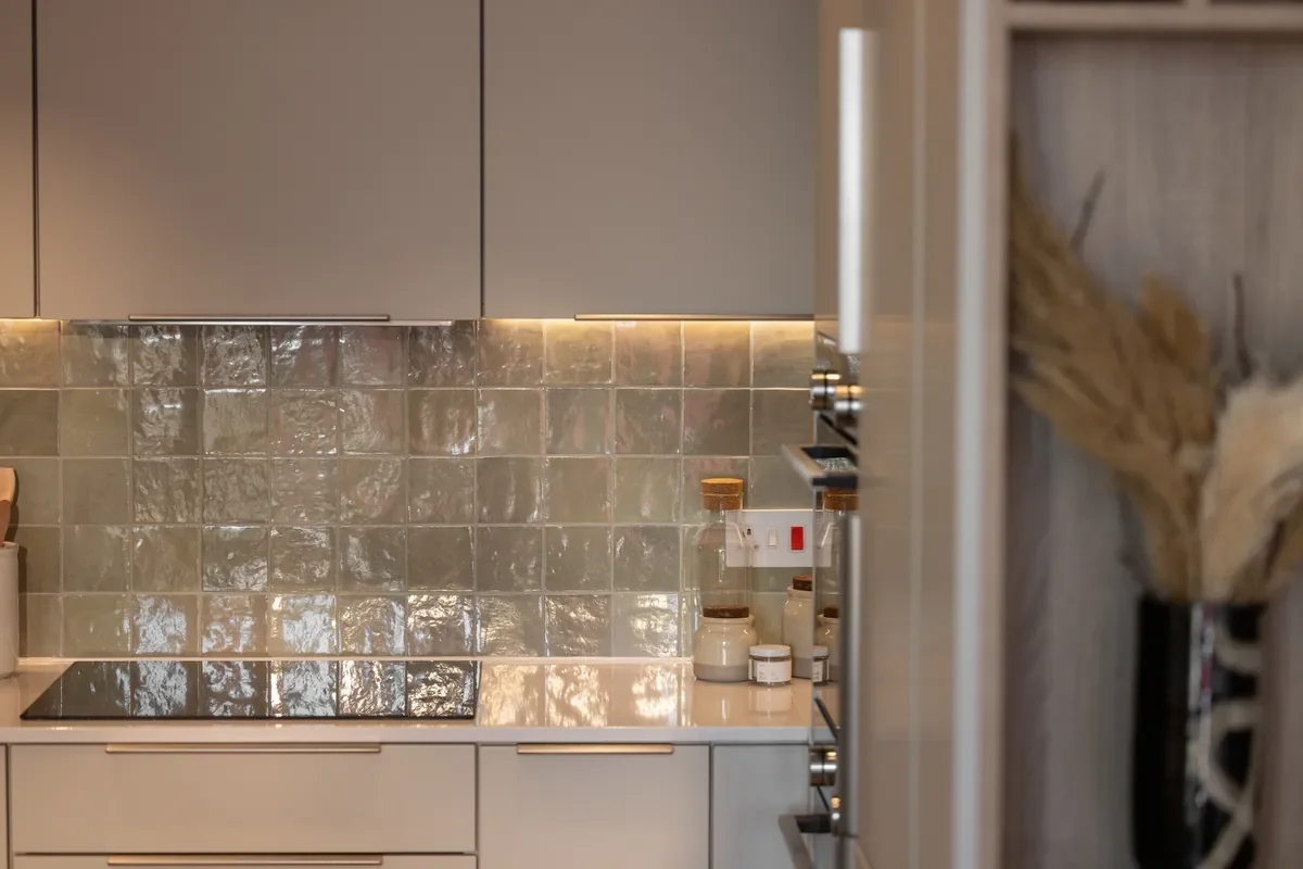 Artisi Hammersmith Town Hall London W6 2 Bed Apartment Kitchen Iridescent Zellige Splashback Induction Hob Cream Cabinets