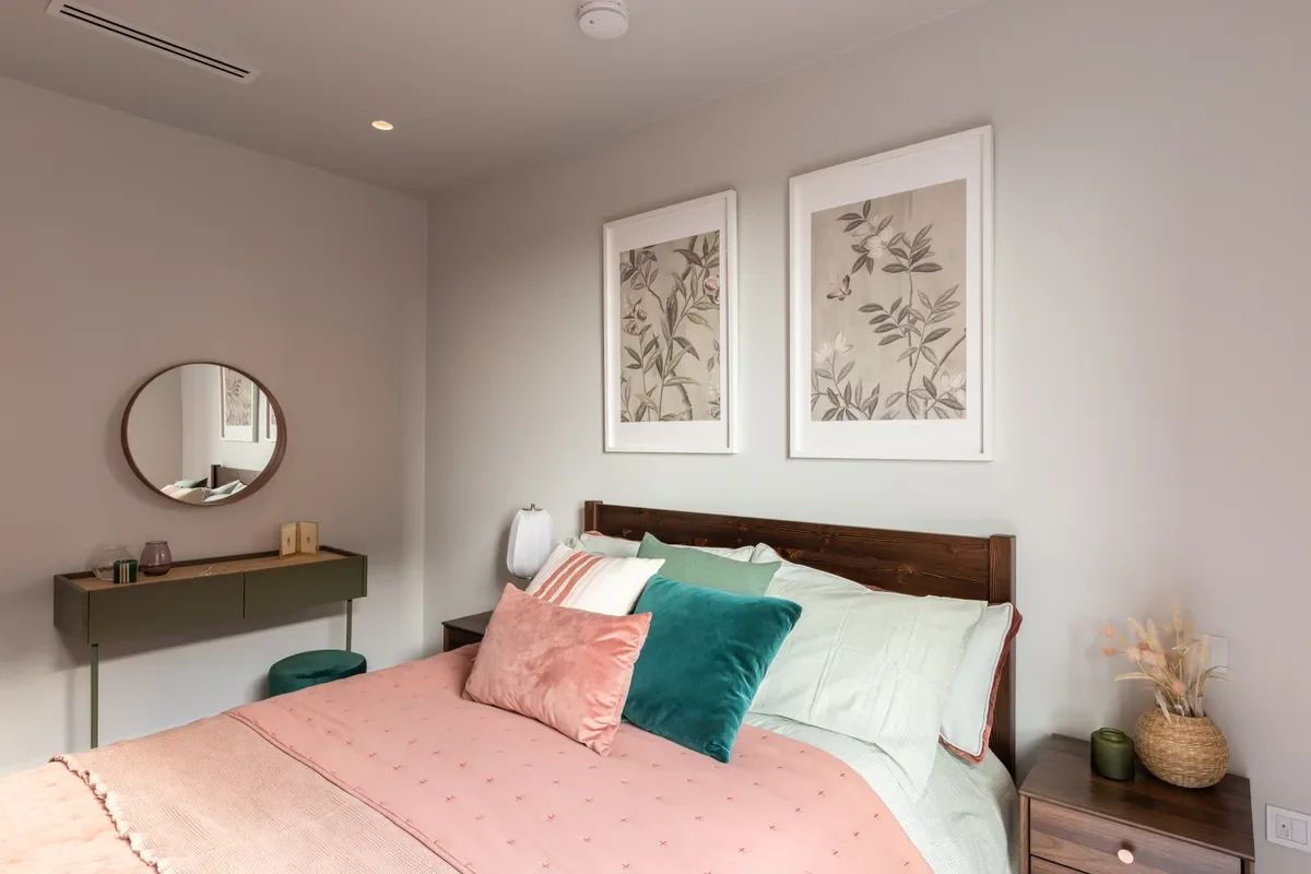 Artisi Hammersmith Town Hall London W6 2 Bed Show Home Master Bedroom Pink Bedding Botanical Art Dark Wood Headboard
