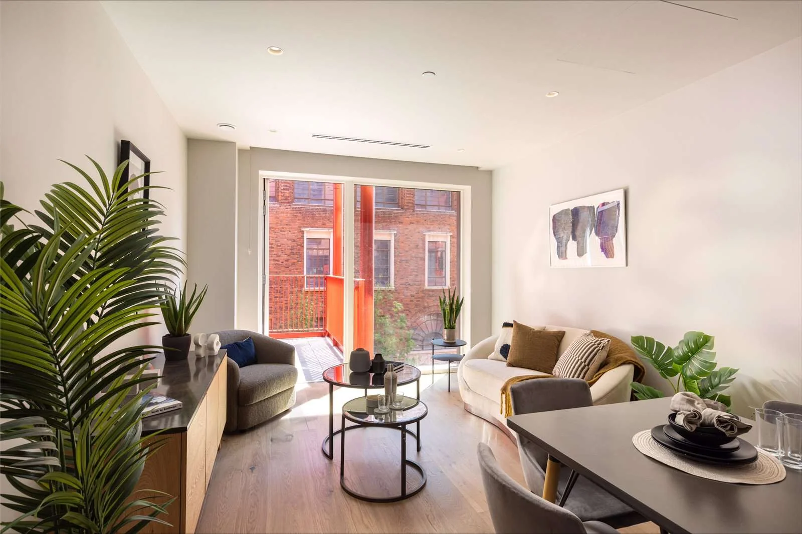 Artisi Hammersmith Town Hall London W6 Open Plan Living Room Balcony Doors Tropical Plants Brick Courtyard View