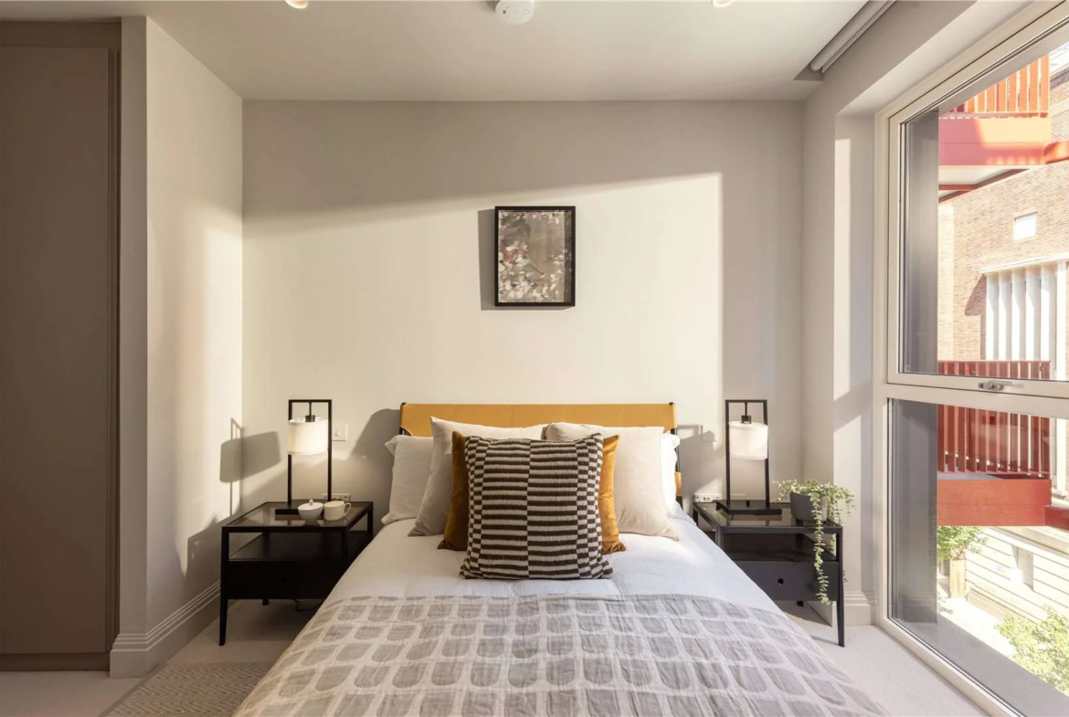 Artisi Hammersmith Town Hall London W6 Show Home Bedroom Yellow Leather Headboard Large Window Red Balcony View