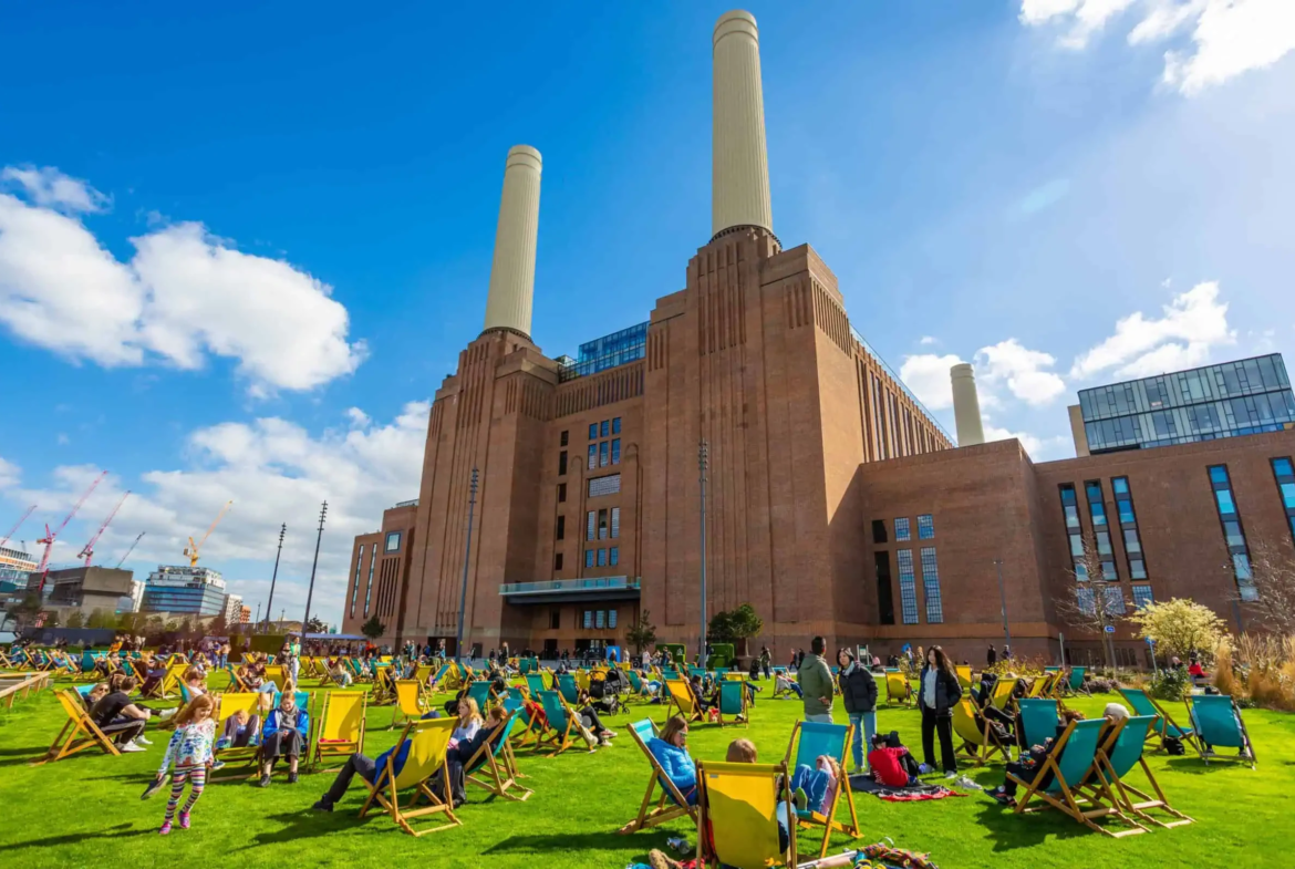 Battersea Power Station Sw11 Exterior Deckchairs Four Chimneys Sunny Day