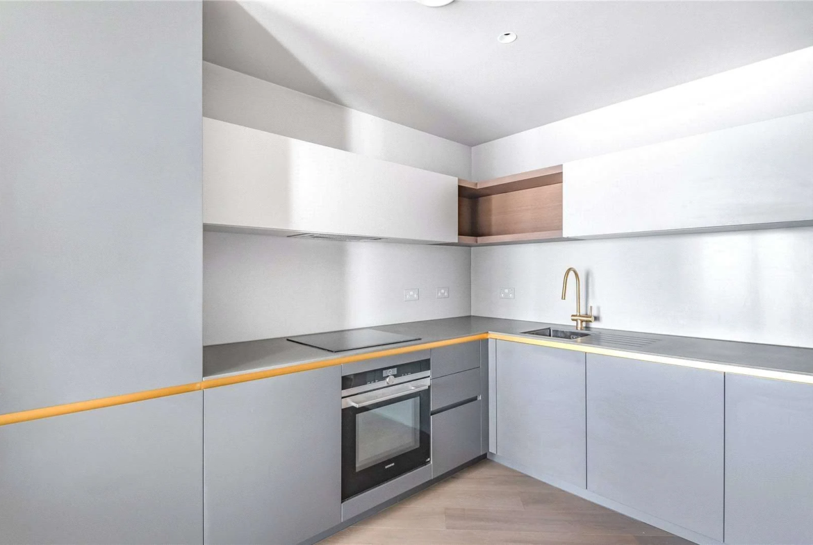 Peninsula Riverfront Greenwich London Se10 Kitchen Grey Cabinets Brass Tap Integrated Oven