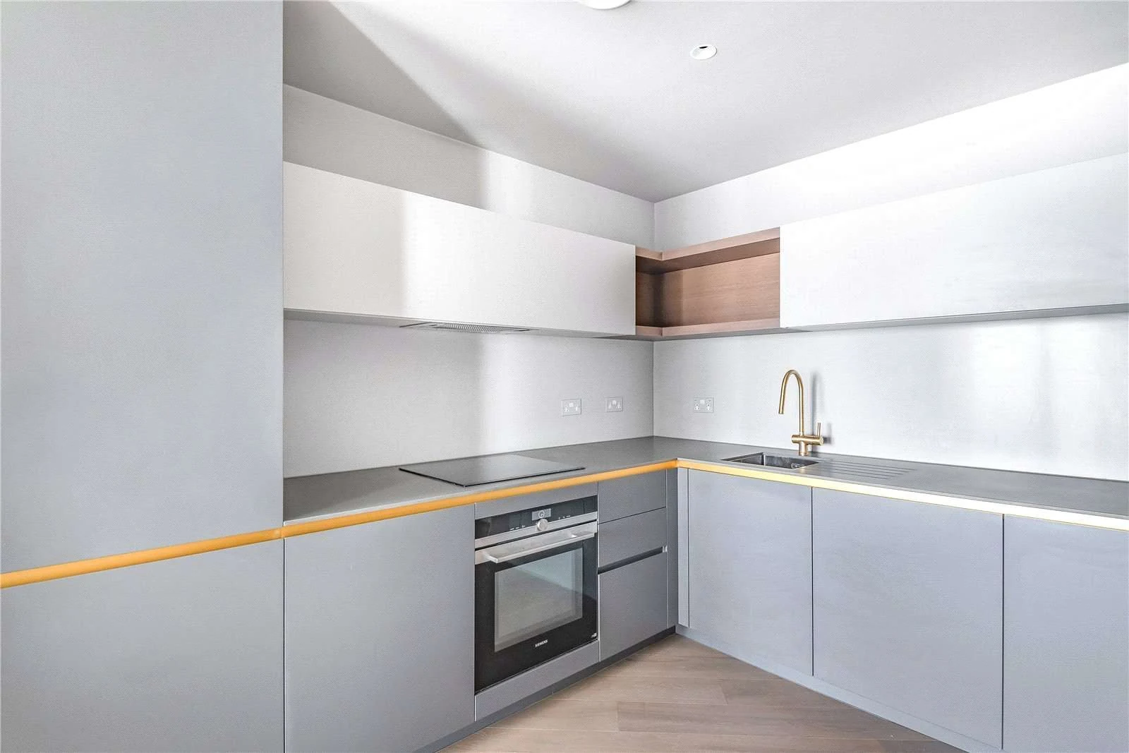 Peninsula Riverfront Greenwich London Se10 Kitchen Grey Cabinets Brass Tap Integrated Oven
