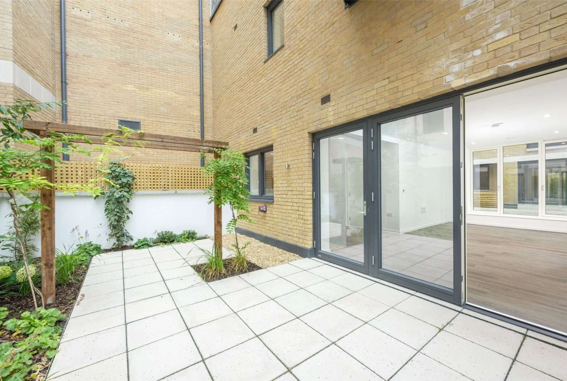 The Auria 2 Cantle Mews W10 Rear Garden Pergola Bifold Doors Yellow Brick Facade