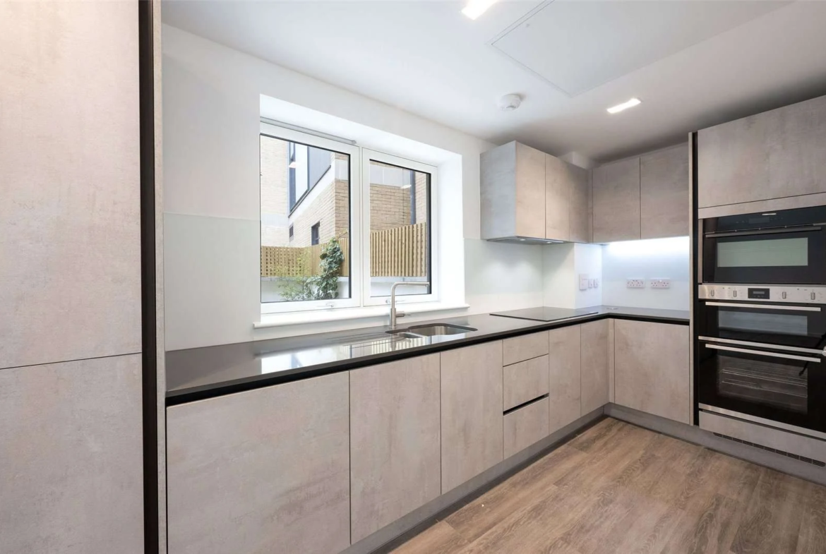 The Auria 2 Cantle Mews Portobello Square W10 Kitchen Concrete Effect Cabinets Dark Worktop Garden View