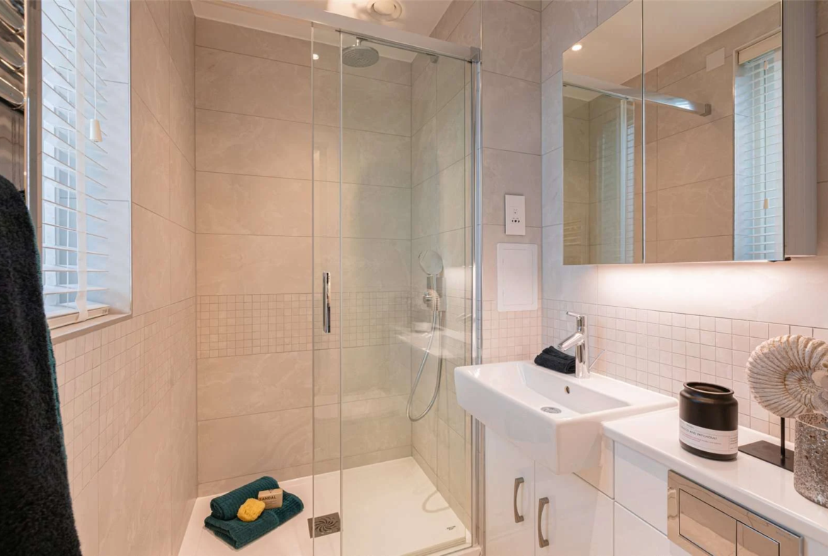 The Auria Portobello Square W10 Ensuite Shower Room Stone Tiles Glass Screen Vanity Unit