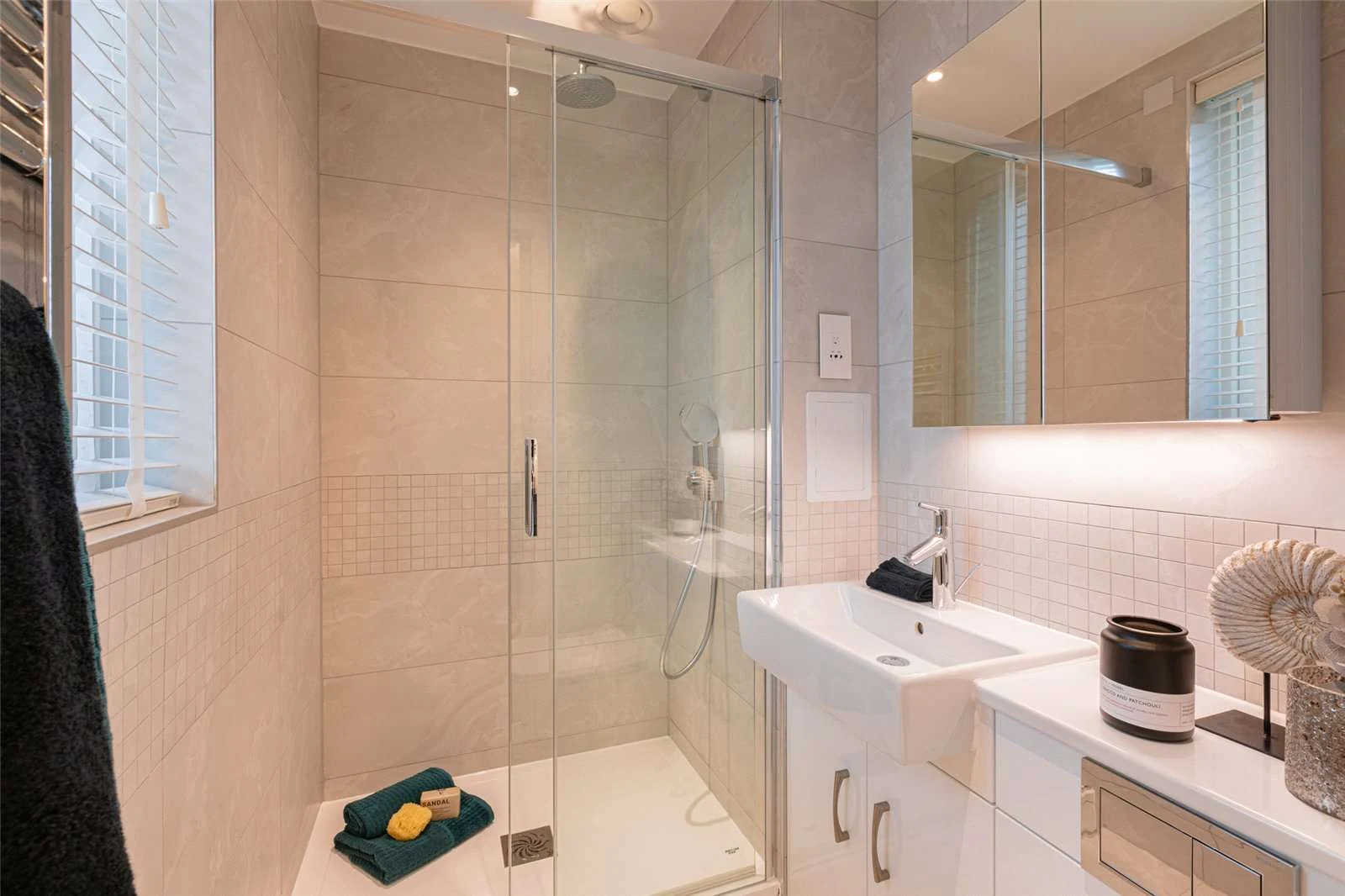 The Auria Portobello Square W10 Ensuite Shower Room Stone Tiles Glass Screen Vanity Unit