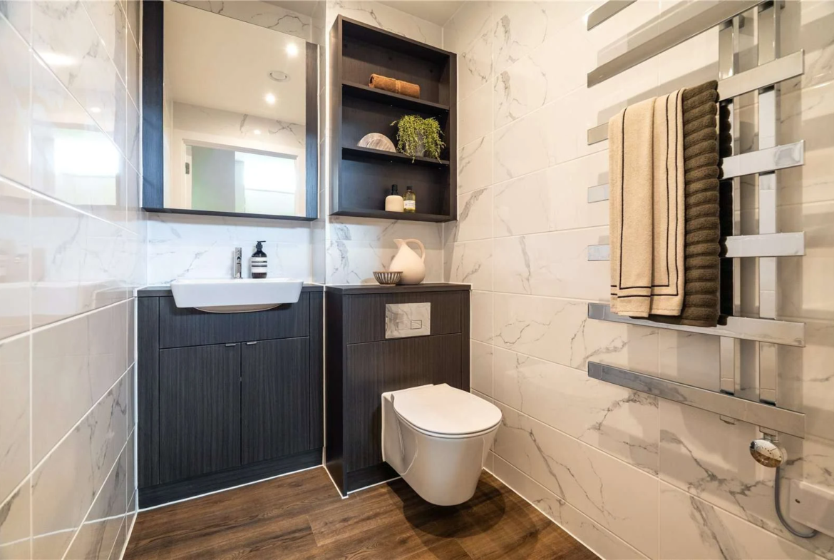 The Auria Portobello Square W10 Guest Bathroom Marble Tiles Dark Vanity Heated Towel Rail