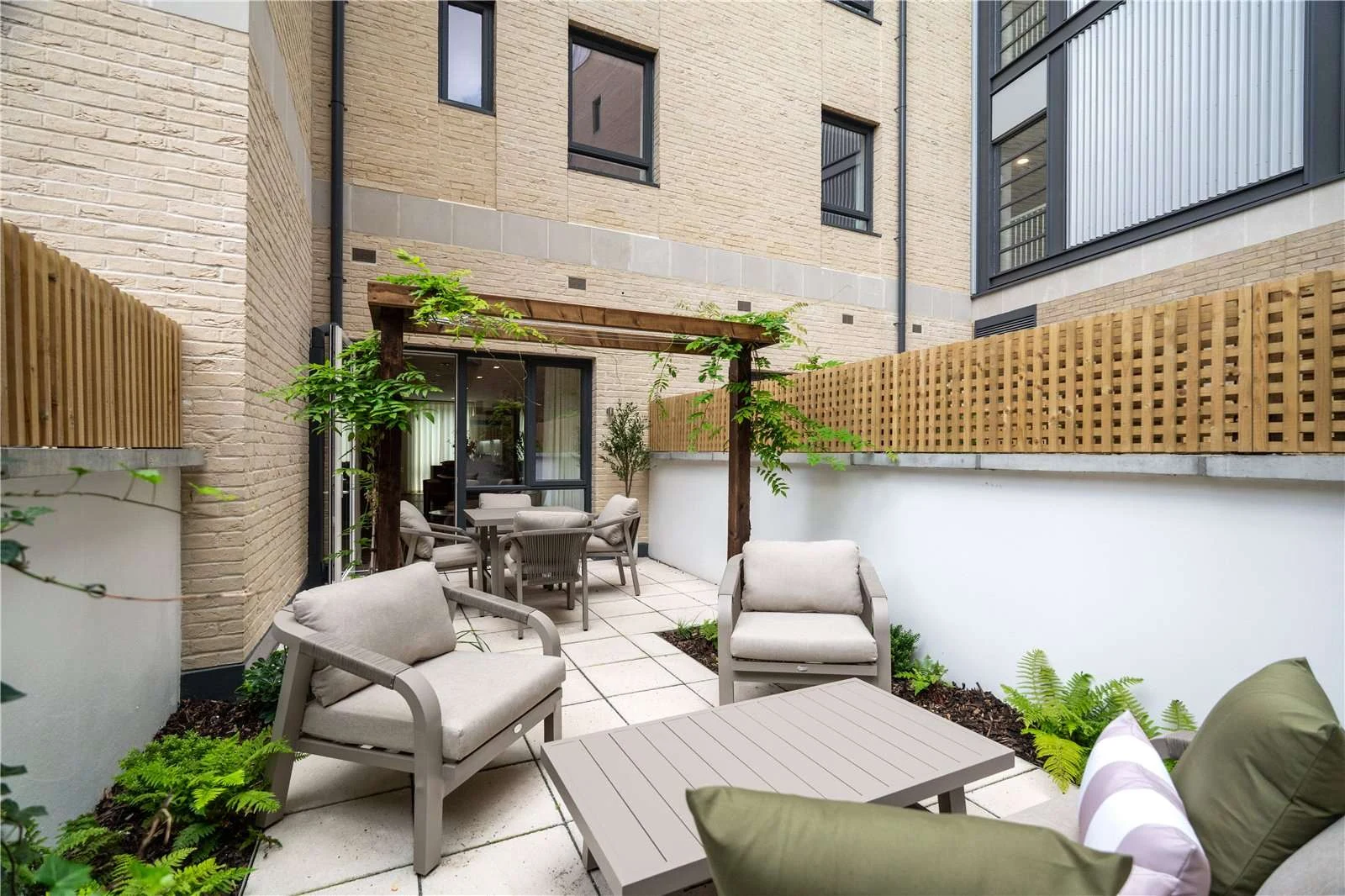 The Auria Portobello Square W10 Rear Garden Terrace Pergola Lounge Seating Cream Brick Mews