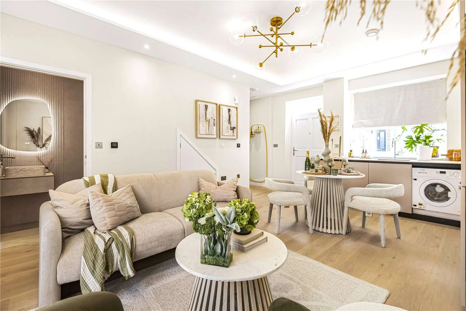 The Warwick Ealing W5 5pt London Living Room Open Plan Layout Kitchen View Wood Floor Gold Pendant Light Sofa